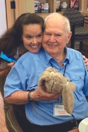 Caregiver laughing with elderly woman